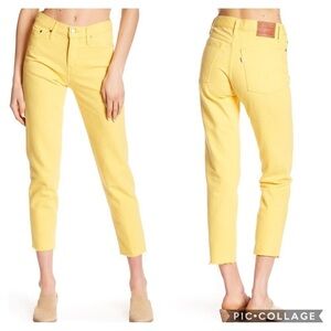 Levi's Wedgie Fit high-rise tapered jeans with a raw cropped hem in yellow